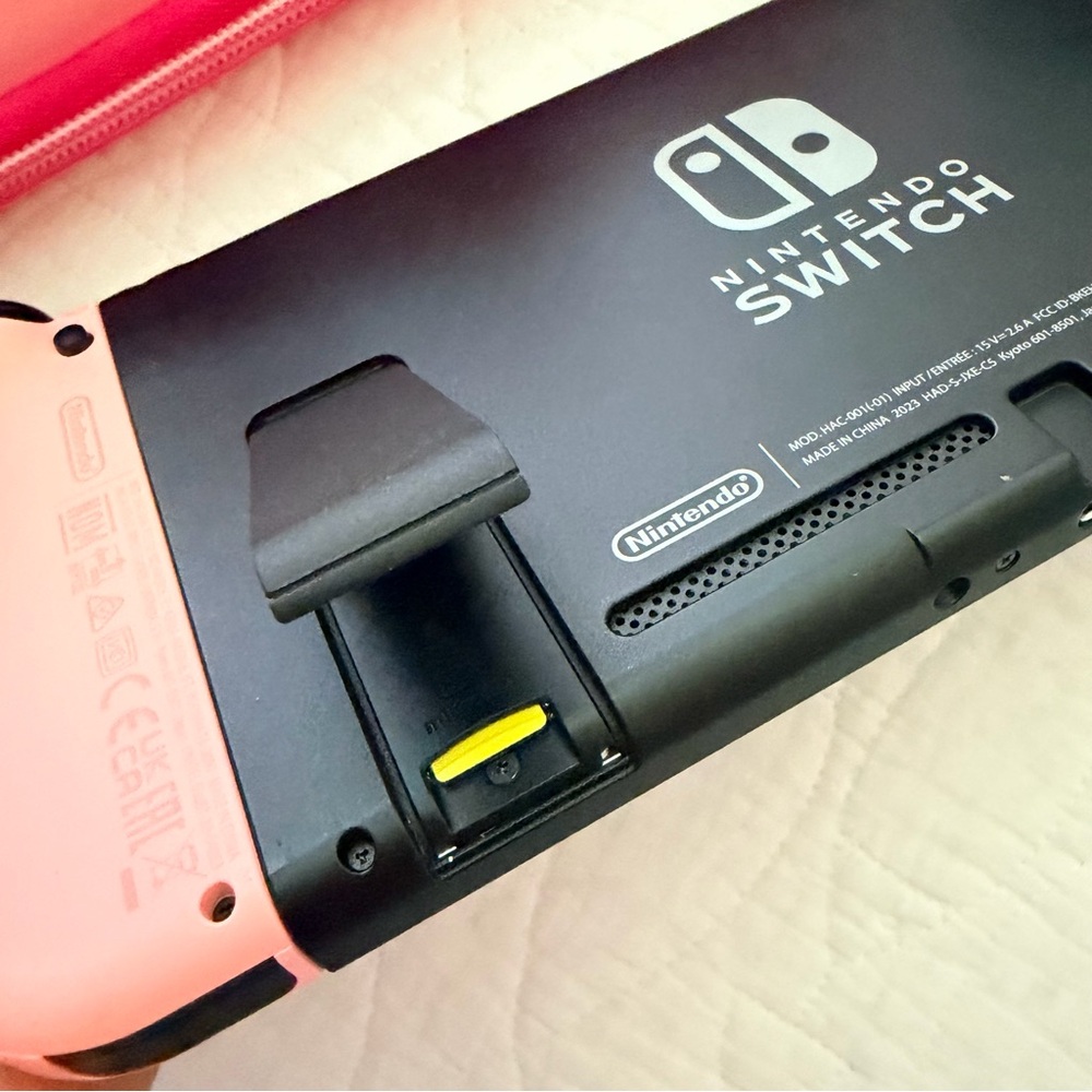 Pink Nintendo Switch Console with Kirby Case - Picture 5 of 8